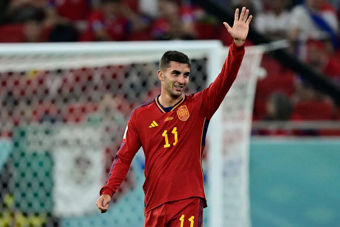 Spain's forward #11 Ferran Torres reacts after scoring his team's fourth goal.