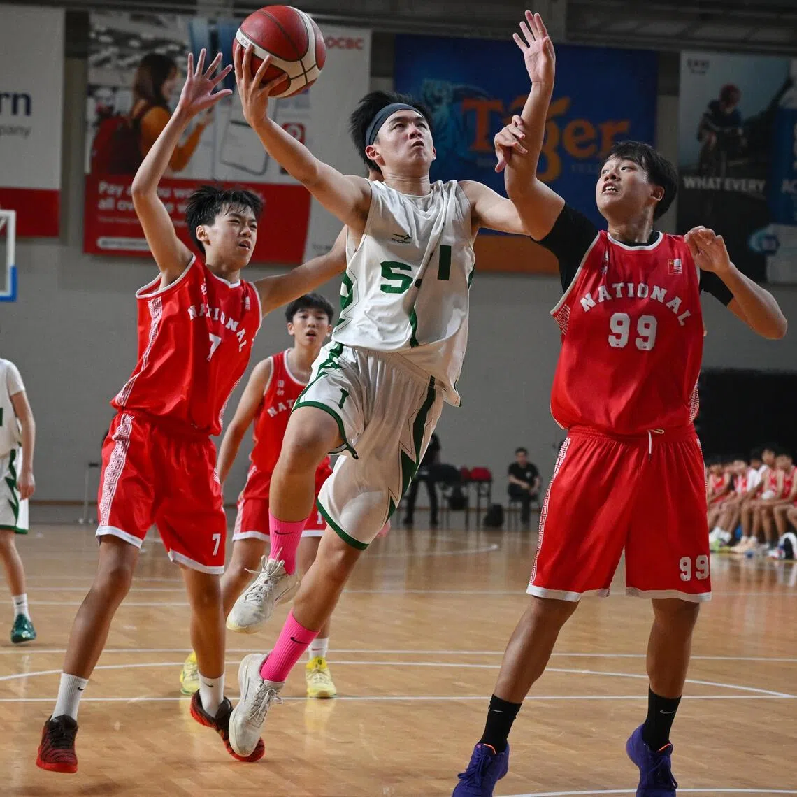 St Joseph’s Institution’s Houston Cheng was hard to miss with his black headband and pink socks as he scored 37 points to help his team beat National Junior College 74-48 in the C Division boys’ basketball League 1 final.