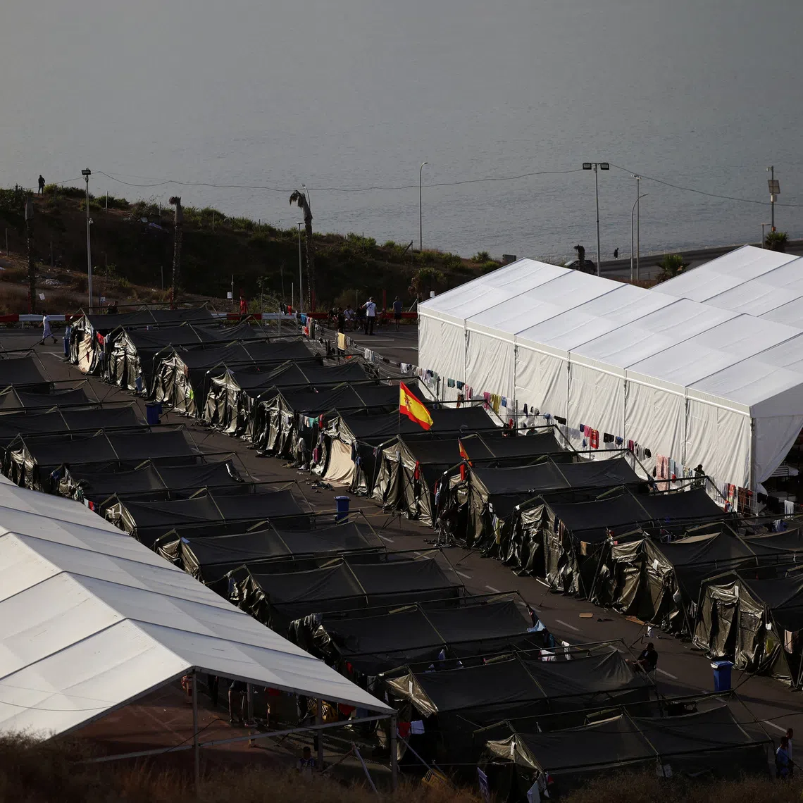 FILE PHOTO: Improvised migrant center following recent mass crossings of migrants from Morocco into Ceuta, Spain, October 1, 2026. REUTERS/Pedro Nunes/File Photo