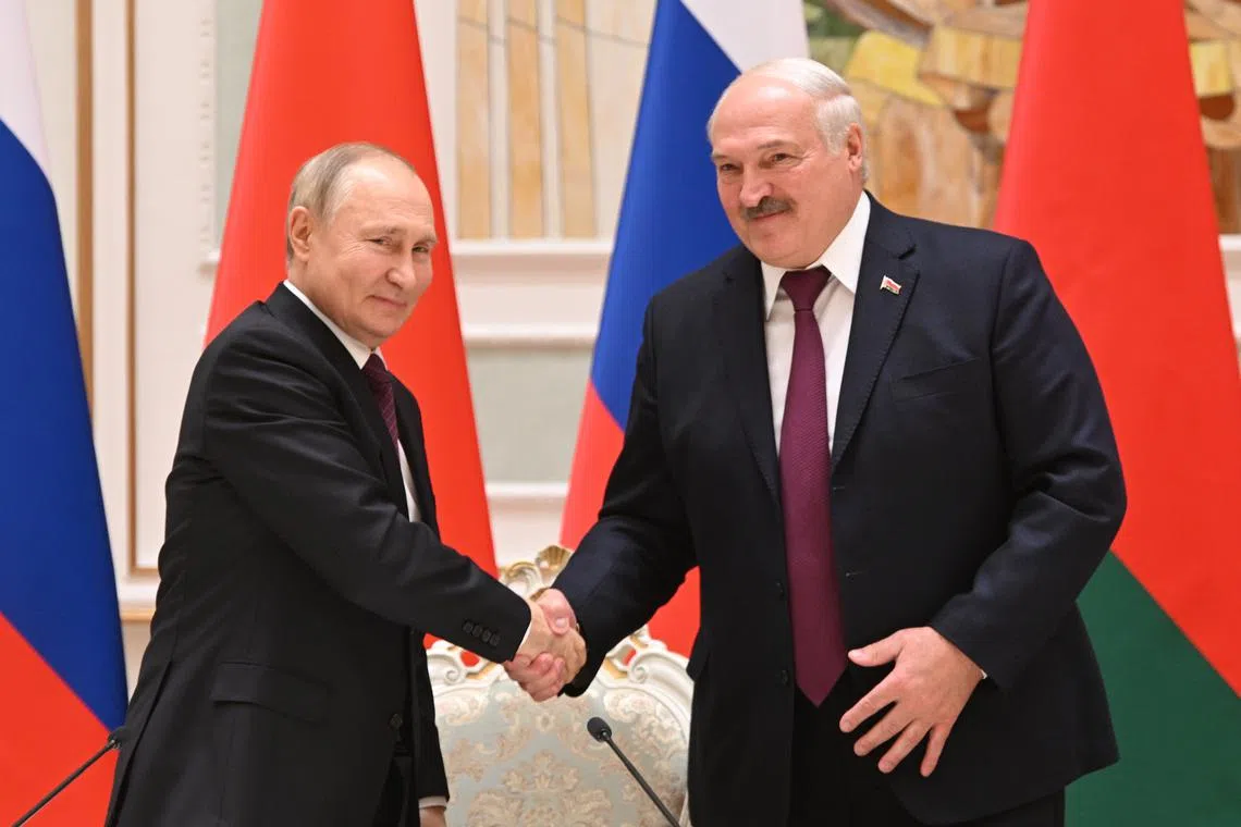 Russian President Vladimir Putin (left) and Belarusian President Alexander Lukashenko meet in Minsk, on Dec 19, 2022.