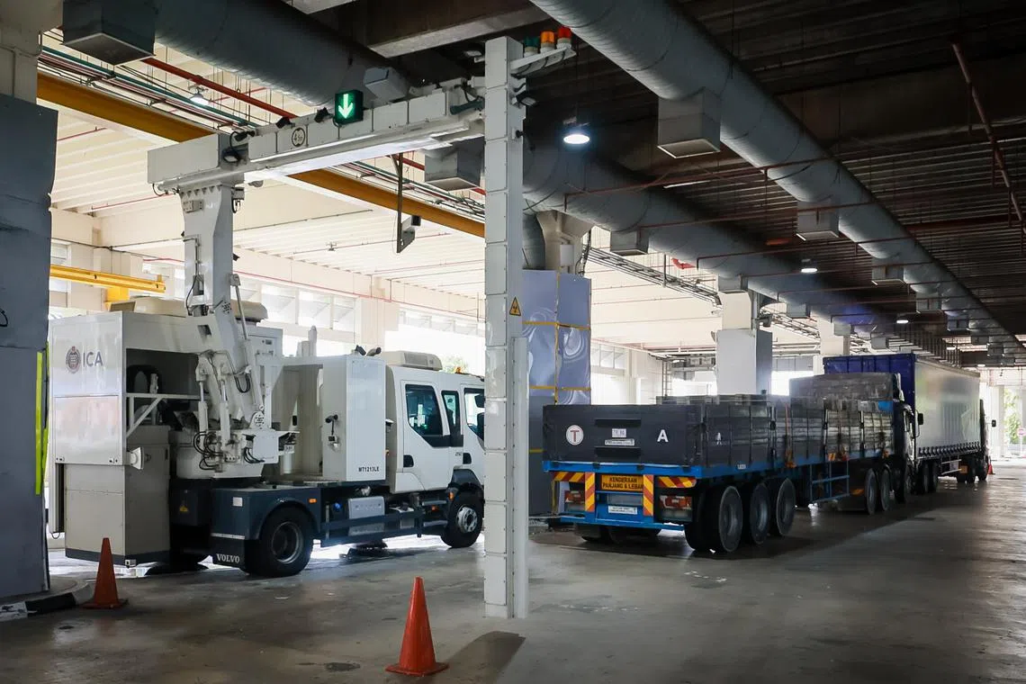 A lorry passing through the Mobile Cargo Inspection System at Tuas Checkpoint, Aug 4, 2023.