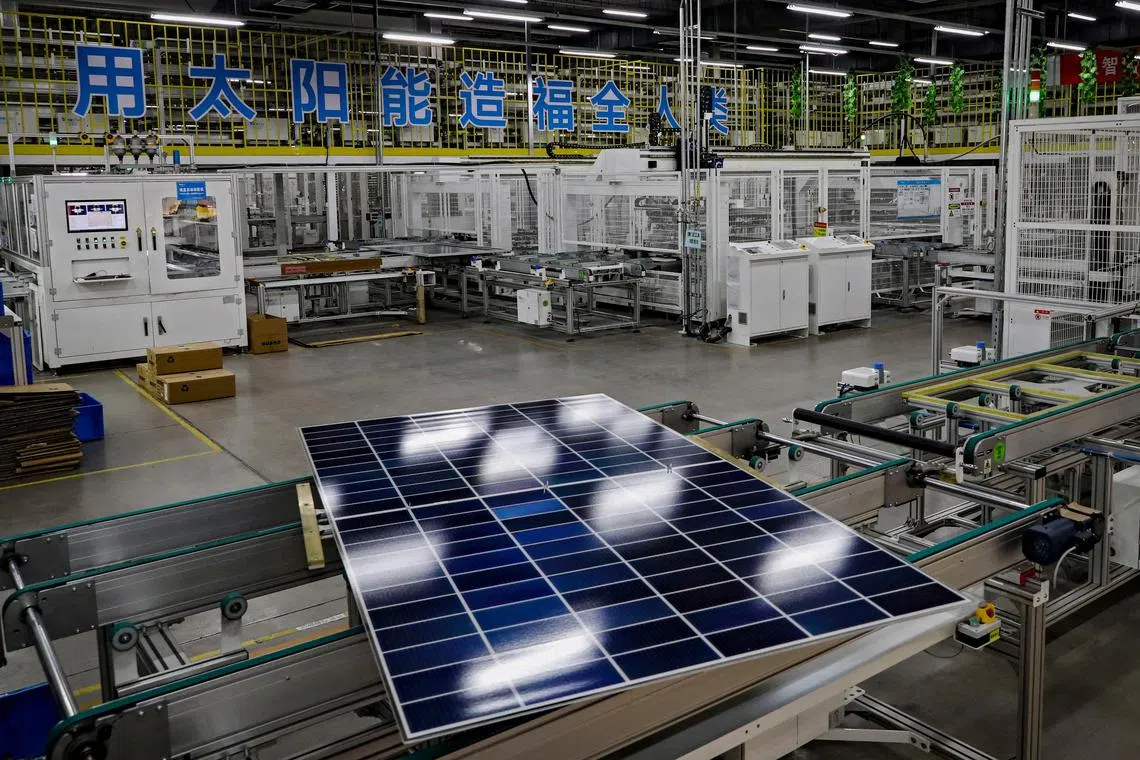 This photo taken on June 4, 2024 shows a solar photovoltaic panel on a production line at a factory in Huai'an, in eastern China's Jiangsu province. (Photo by AFP) / China OUT