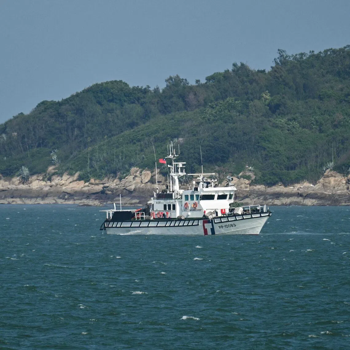 A Taiwan Coast Guard boat patrols, as seen from a boat with Chinese tourists, Taiwan's Kinmen Islands, off Xiamen, on May 25. 