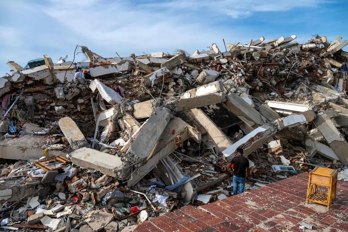 Volunteers and rescuers help to find survivors in a collapsed building in Caraballeda, La Guaira state, Venezuela, on June 30.