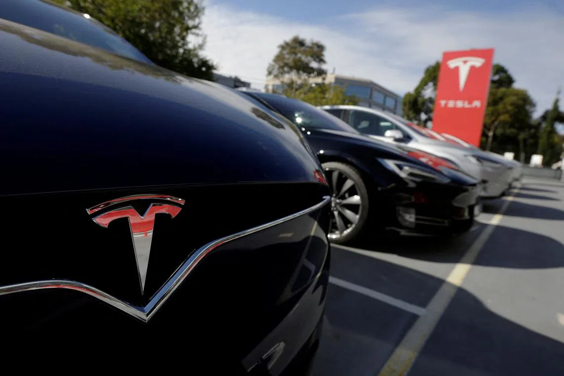 A Tesla Model X is photographed alongside a Model S at a Tesla electric car dealership in Sydney, Australia, on May 31, 2017.  