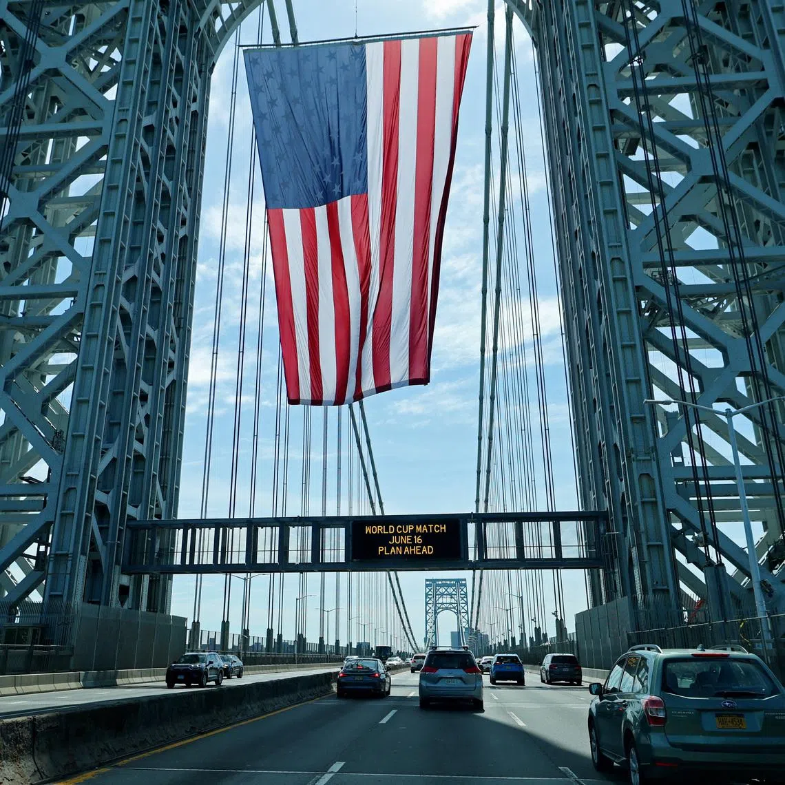 Soccer Football - FIFA World Cup 2026 - Group E - Ivory Coast v Ecuador - New Jersey, U.S. - June 14, 2026 A United States national flag hangs on the George Washington bridge between New Jersey and New York ahead of the match REUTERS/Mike Segar