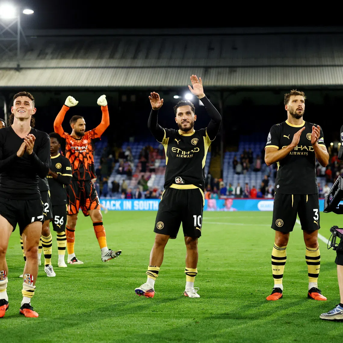 Soccer Football - Premier League - Crystal Palace v Manchester City - Selhurst Park, London, Britain - August 28, 2026 Manchester City's Phil Foden, Rayan Cherki and Ruben Dias celebrate after the match Action Images via Reuters/Peter Cziborra