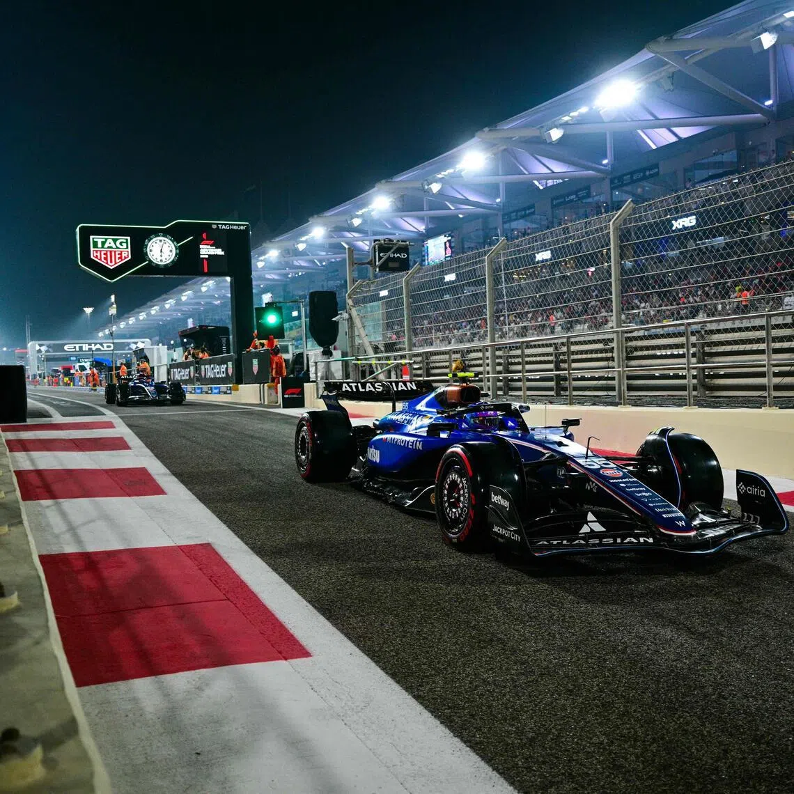 Williams' Carlos Sainz drives out of the pit lane during the qualifying session ahead of the Abu Dhabi Grand Prix at the Yas Marina Circuit on Dec 6, 2025.