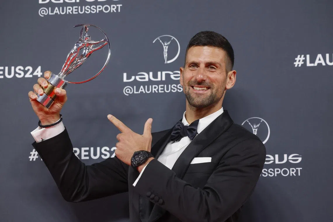Novak Djokovic poses for photographers after receiving the 2024 Laureus World Sportsman of the Year award in Madrid.