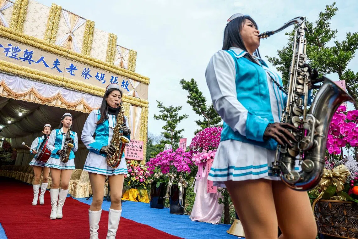 The Taiwanese all-female funeral marching band Da Zhong performing during a funeral in Changhua City, on Feb 25, 2025.