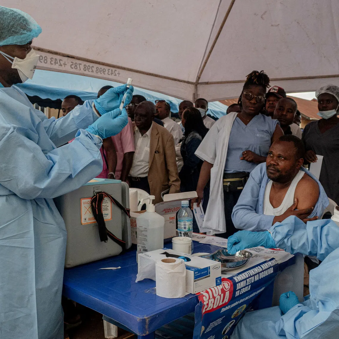 FILE PHOTO: Health workers and humanitarian responders on the front lines of the Ebola response gather to receive a vaccination due to their potential exposure to the virus as part of their work with suspected cases, including contacts, as aid agencies intensify efforts to contain the Ebola outbreak involving the Bundibugyo strain, in the North Kivu Province of the Democratic Republic of the Congo, October 16, 2026. REUTERS/Gradel Muyisa Mumbere/File Photo