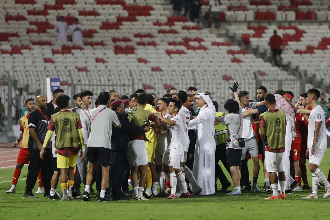 Bahrain and Indonesia players clash after their World Cup qualifying match on Oct 10.