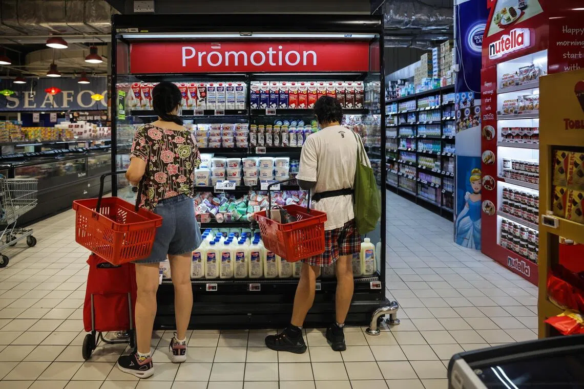 Singapore retail sales stay in the black in May, but spending eases from April