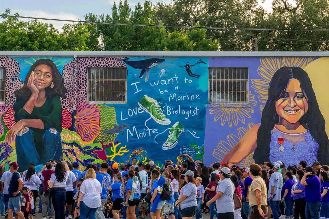 Community members visit murals of 10-year-olds Maite Rodriguez and Amerie Jo Garza, victims of the Robb Elementary School shooting.