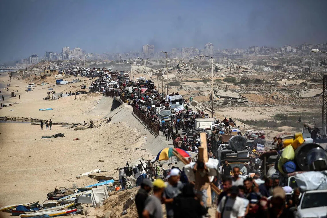 Palestinians fleeing Gaza City with their belongings on Sept 19, amid an Israeli assault on the city.