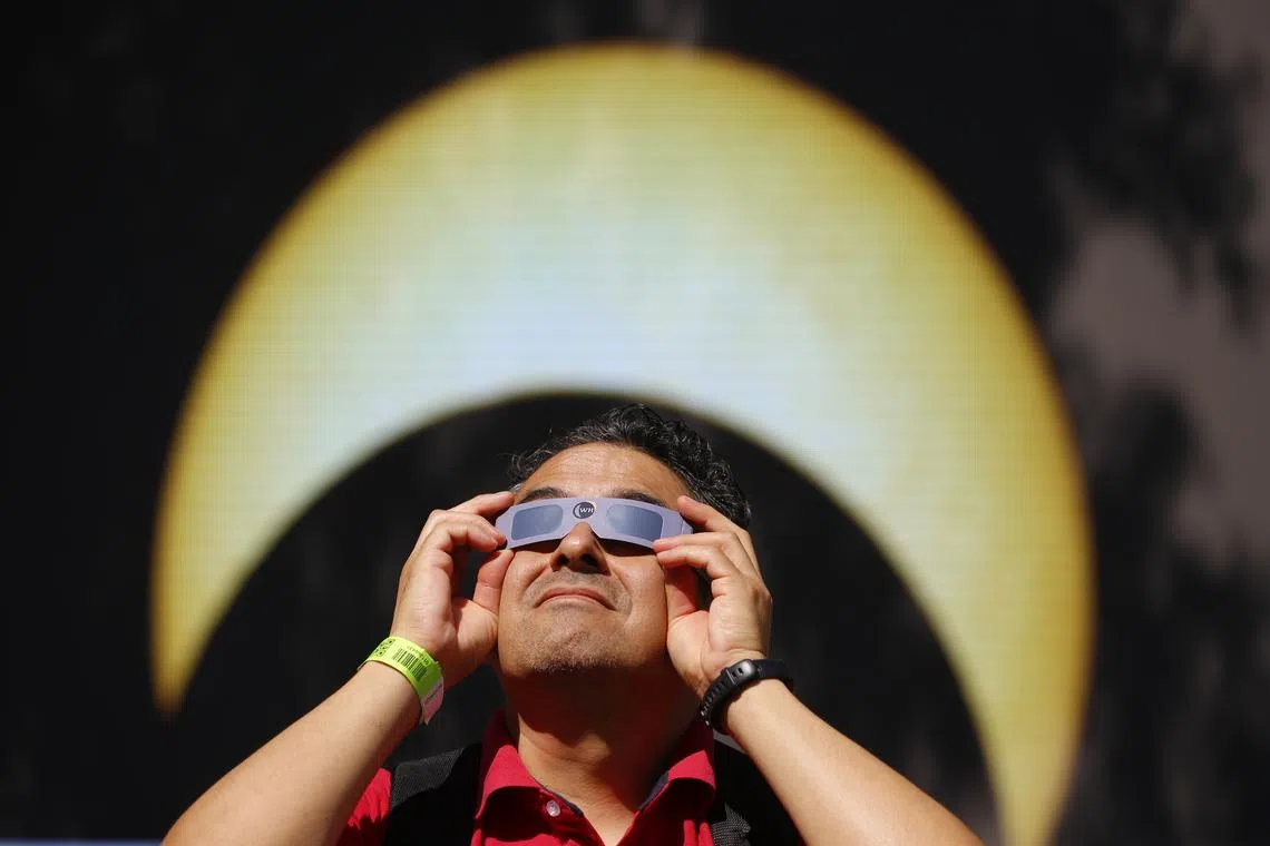 A man looking at the annular solar eclipse from the city of Guadalajara, in the state of Jalisco, Mexico, on Oct 14, 2023. 