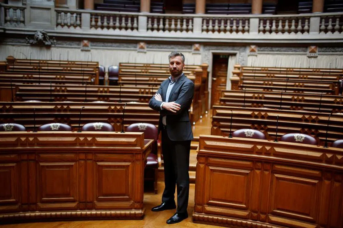 FILE PHOTO: Pedro Nuno Santos poses for a portrait between the legislators of Socialist party and left bloc inside Portuguese parliament in Lisbon, Portugal June 21, 2016. REUTERS/Rafael Marchante/File Photo
