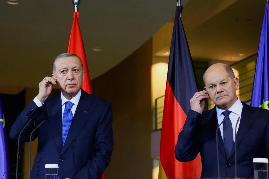 Turkish President Tayyip Erdogan (left) was critical of Israel at a press conference in Berlin with German Chancellor Olaf Scholz.