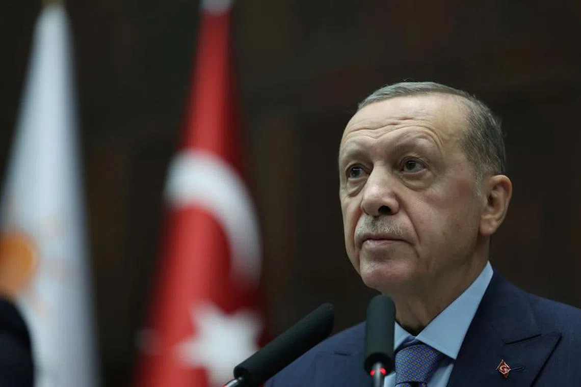 Turkish President Tayyip Erdogan addresses members of parliament from his ruling AK Party (AKP) during a meeting at the Turkish parliament in Ankara, Turkey, October 25, 2023. Murat Cetinmuhurdar/PPO/Handout via REUTERS/File Photo