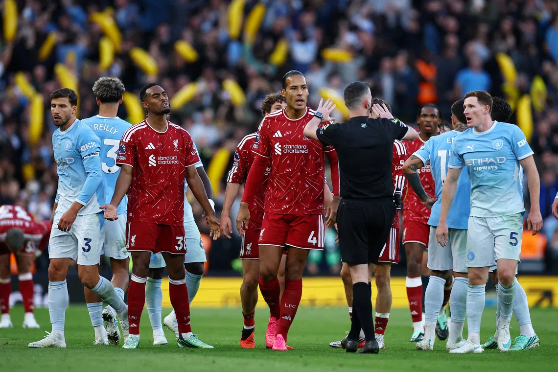 Liverpool’s Ryan Gravenberch reacts after he is shown a red card by referee Chris Kavanagh.