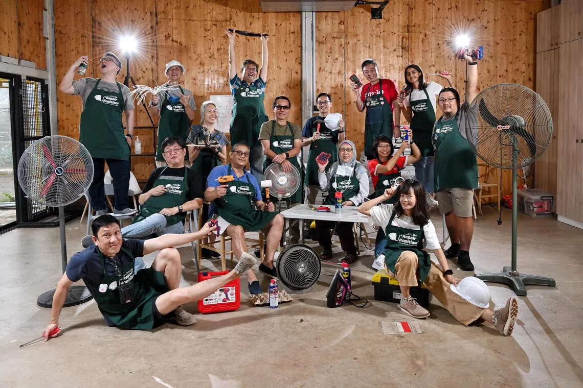 Repair Kopitiam coaches and volunteers posing with the tools of their trade.