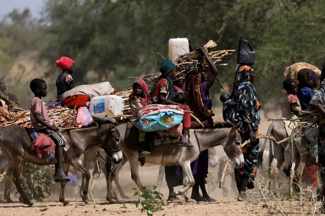 Sudanese refugees fleeing the violence in Sudan's Darfur region and newly arrived ride their donkeys looking for space to temporarily settle, near the border between Sudan and Chad in Goungour, Chad on May 8, 2023. 