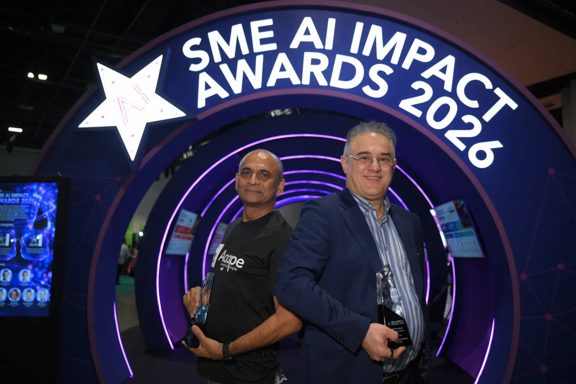 Anil David (left), founder of Agape Connecting People, and Blue Aqua International Group founder Dr. Farshad Shishehchian, pictured after the SME AI Impact Awards ceremony as part of IMDA’s SMEs Go Digital Day at the Suntec Convention Centre on Oct 13.