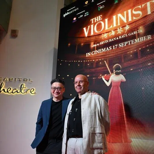 Director Ervin Han with co-director Raul Garcia on the red carpet for the gala premiere of The Violinist at The Capitol Theatre on Sept 3.