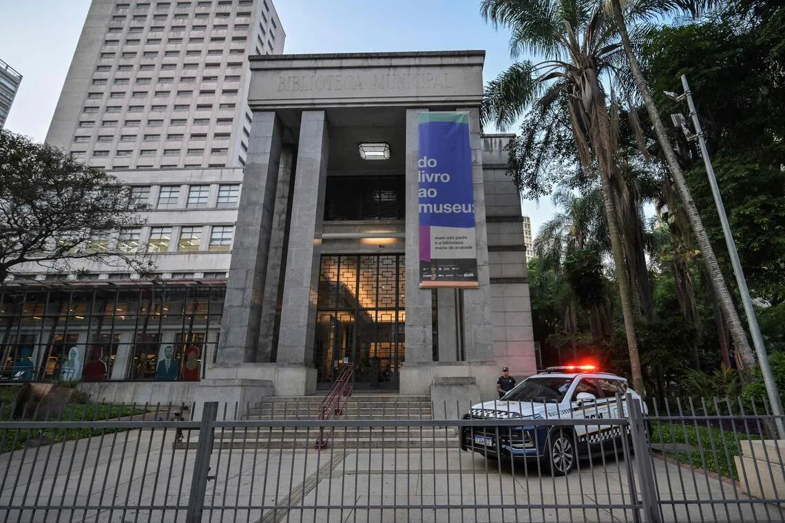 A Brazilian police patrol stands in front of the Mario de Andrade Public Library in downtown Sao Paulo, Brazil on Dec 7.
