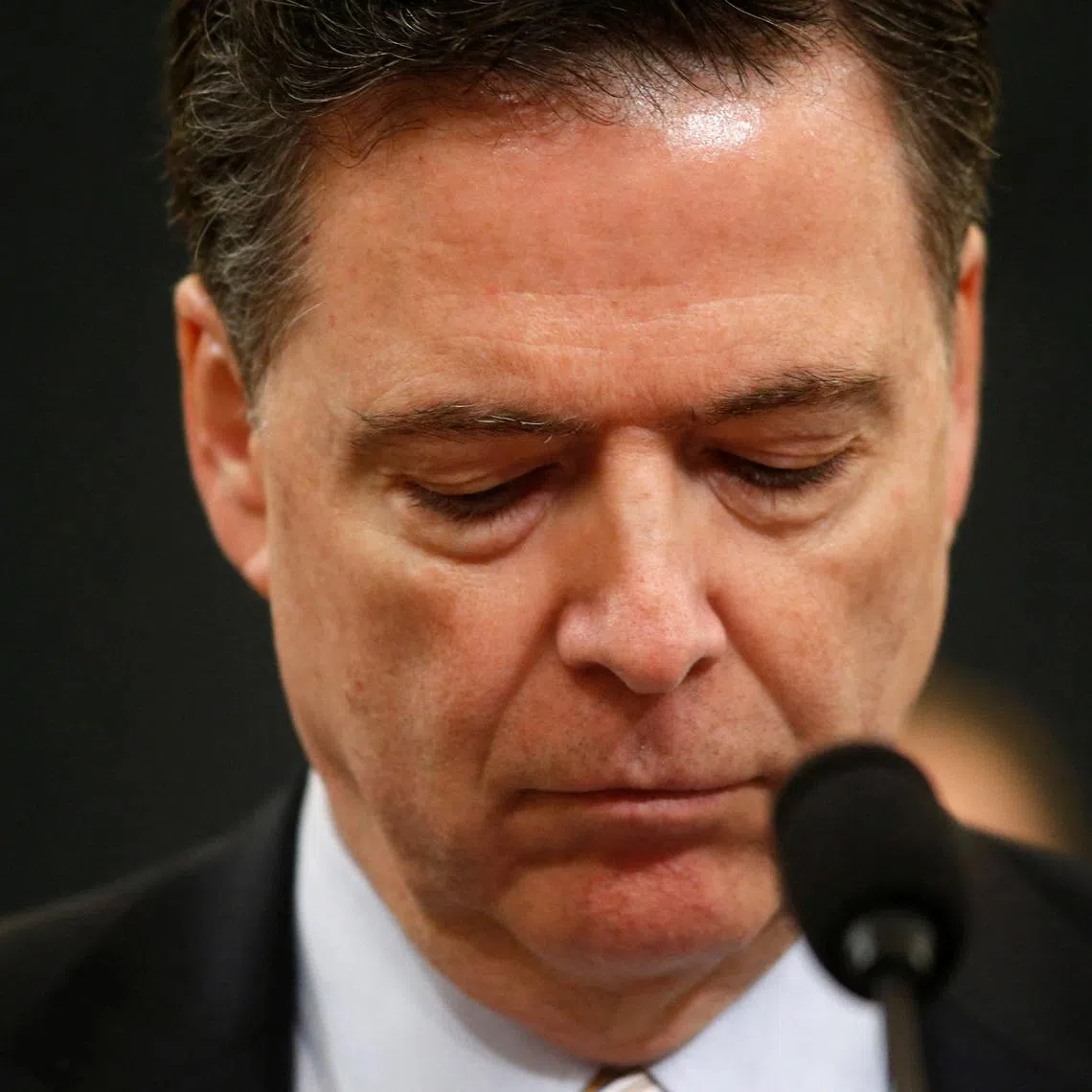 FILE PHOTO: FBI Director James Comey testifies before the House Intelligence Committee hearing into alleged Russian meddling in the 2016 U.S. election on Capitol Hill in Washington, U.S., March 20, 2017. REUTERS/Joshua Roberts/File Photo