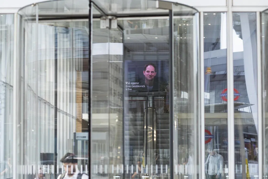 A screen displays an image of Evan Gershkovich, a Wall Street Journal reporter, at News Building, which houses the Wall Street Journal’s local offices, in London, on Aug. 1, 2024. A prisoner swap at a Turkish airport involving seven countries freed Gershkovich and two other Americans held in Russia, along with several jailed Russian opposition figures, the White House said, in the most far-reaching exchange between Russia and the West in decades. (Sam Bush/The New York Times)