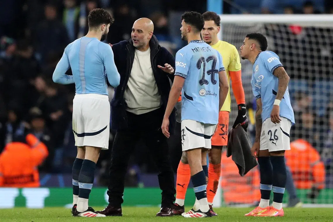 Manchester City manager Pep Guardiola speaking to Josko Gvardiol, Matheus Nunes, Ederson and Savinho, after City's Champions League match against Club Brugge.