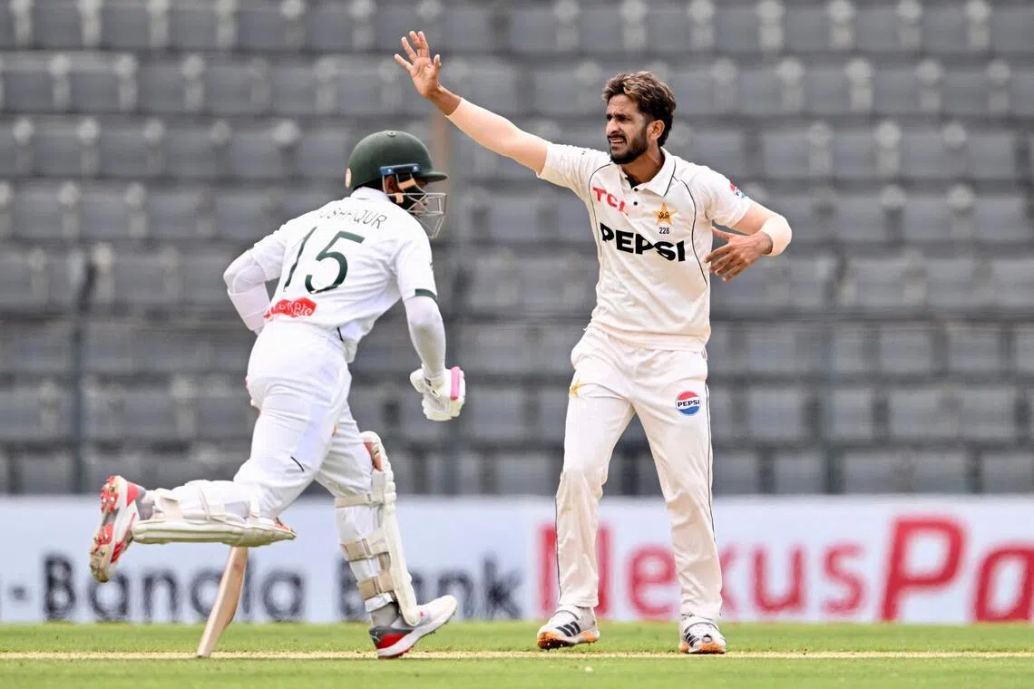 Pakistan’s Hasan Ali gestures as Bangladesh’s Mushfiqur Rahim runs between the wickets on the first day of the second Test at the Sylhet International Cricket Stadium in Sylhet on May 16, 2026. He returned before the end of the morning session after an injury scare.