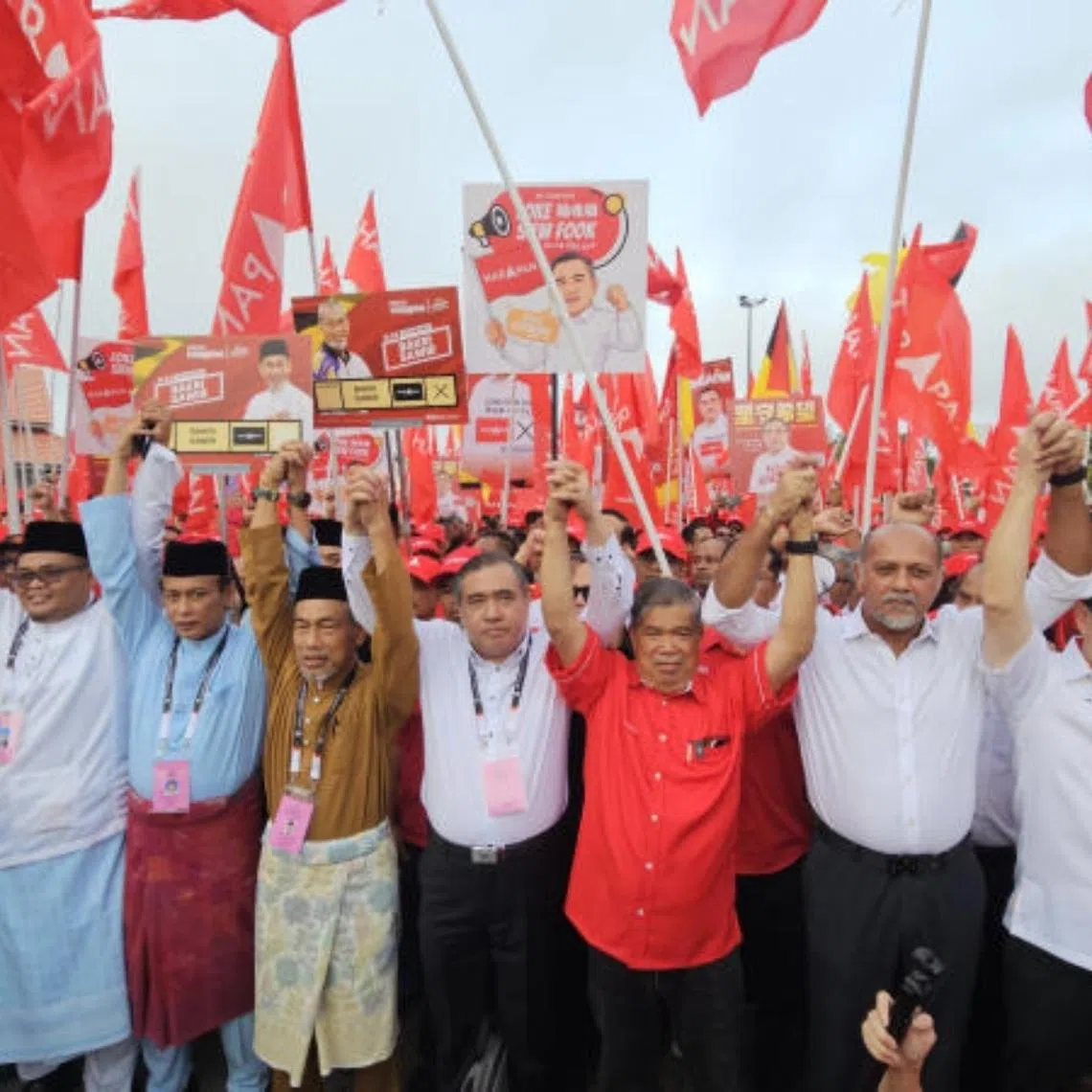 Surrounded by supporters, DAP secretary-general and Transport Minister Anthony Loke (centre) marching towards the nomination centre in Negeri Sembilan on July 18.