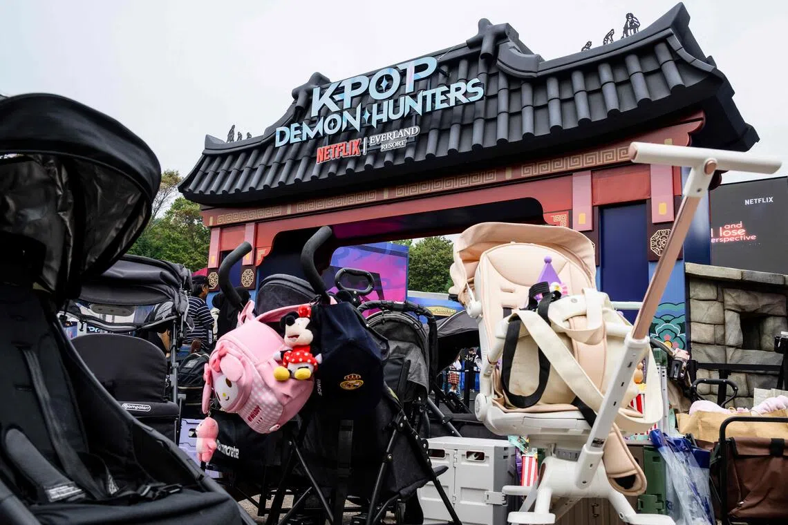 Baby strollers parked outside the entrance of a KPop Demon Hunters-themed zone at the Everland Resort in South Korea's largest theme park in Gyeonggi province. 