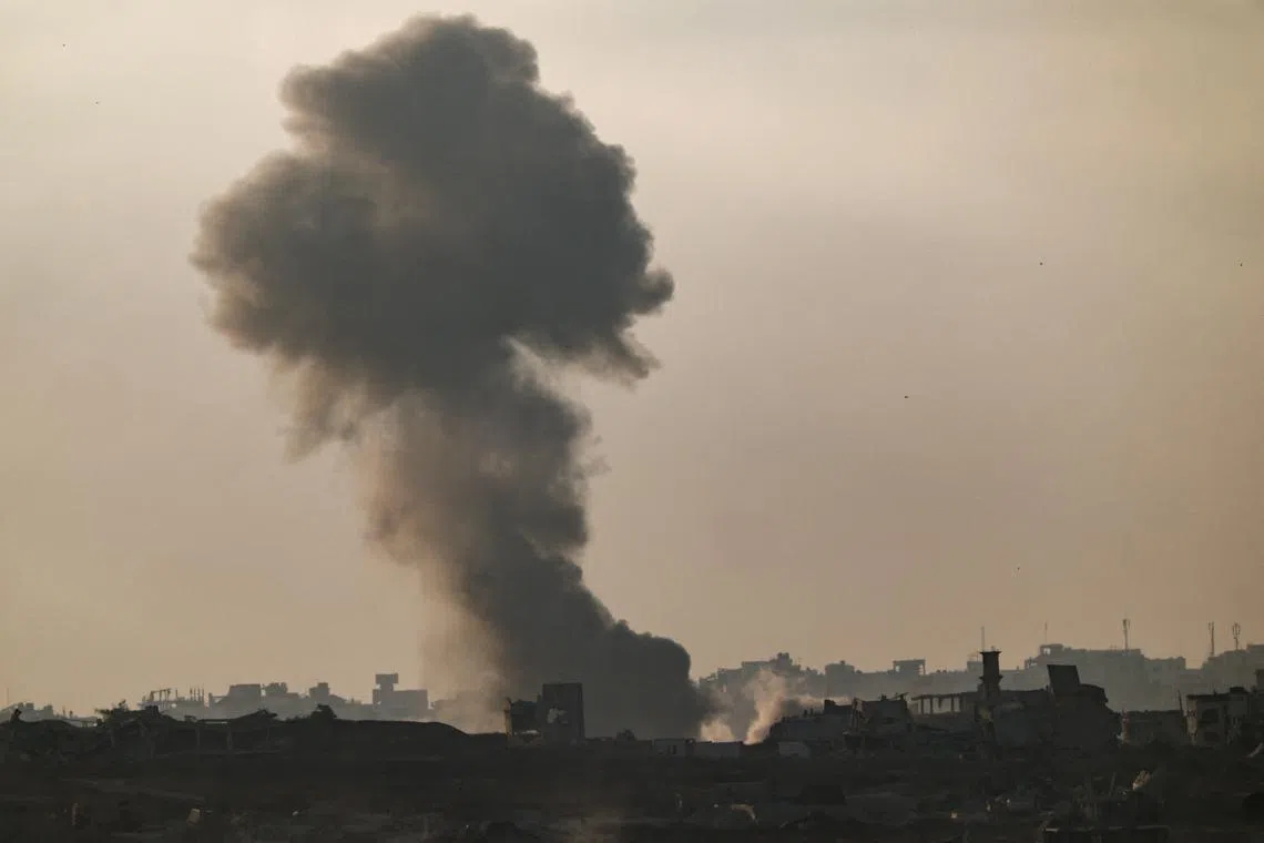 FILE PHOTO: Smoke rises from Gaza after an explosion, as seen from the Israeli side of the border, June 11, 2025. REUTERS/Amir Cohen/File Photo
