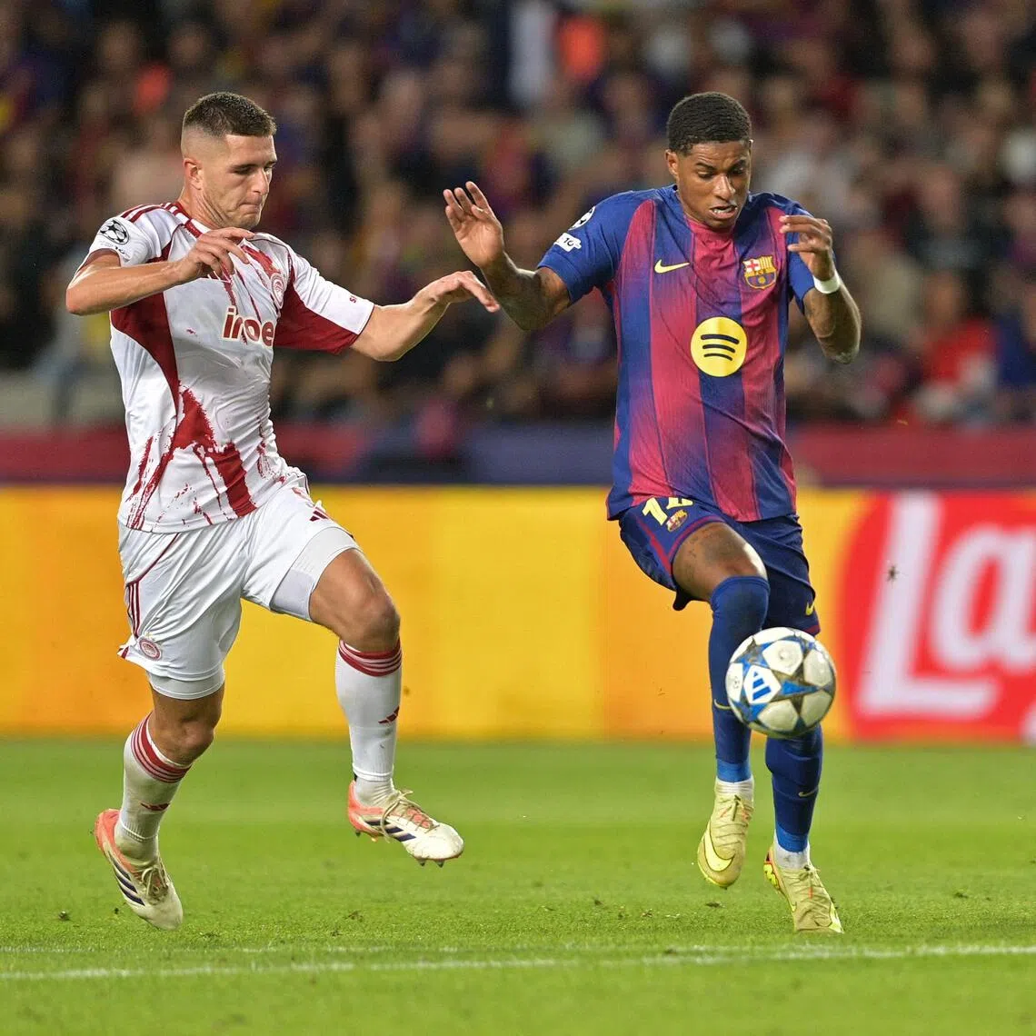 Barcelona's Marcus Rashford controls the ball during the Champions League match against Olympiacos.