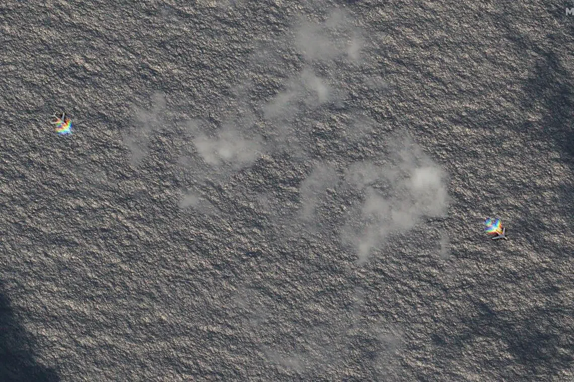 Chinese H-6 bombers fly east of the disputed Scarborough Shoal in the South China Sea, March 24, 2025. Maxar Technologies/Handout via REUTERS