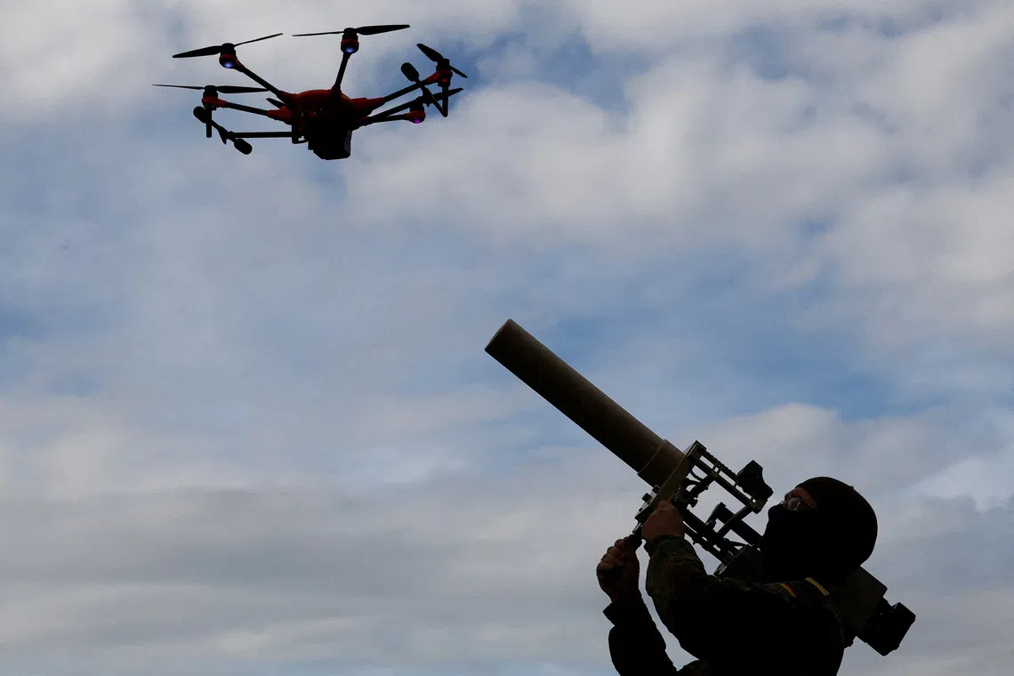 A soldier of the German armed forces demonstrates a HP 47 drone jammer during the defence exercise \"Red Storm Bravo\" in which civilian and military coordination is trained and led by German army Bundeswehr in Hamburg, Germany, September 26, 2025.  REUTERS/Lisi Niesner