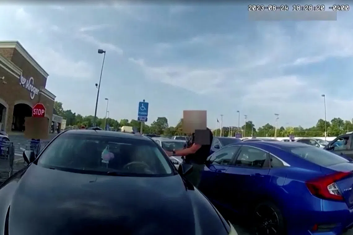 Screen capture obtained from a body camera footage showing an officer fatally shooting a pregnant Black woman in the parking lot of a grocery store in Blendon Township, Ohio on August 24, 2023, after she refused to exit her car and instead bumped him with her vehicle.