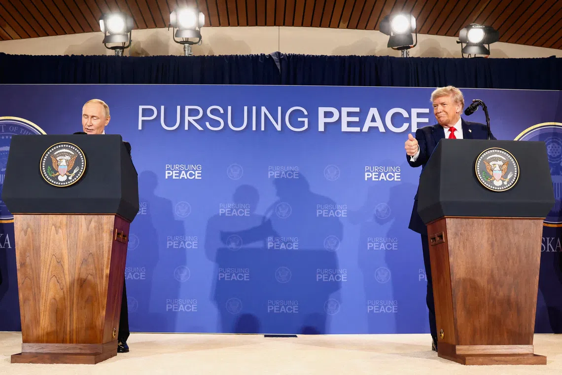 U.S. President Donald Trump and Russian President Vladimir Putin hold a press conference following their meeting to negotiate an end to the war in Ukraine, at Joint Base Elmendorf-Richardson, in Anchorage, Alaska, U.S., August 15, 2025. REUTERS/Kevin Lamarque