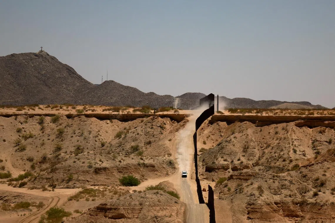 FILE PHOTO: A U.S. Border Patrol vehicle patrols along the border wall, following the establishment of a 260-mile military zone along the southern U.S. border in New Mexico and Texas as part of the Trump administration's crackdown on immigration, in Sunland Park, New Mexico, U.S., May 20, 2025. REUTERS/Jose Luis Gonzalez/File Photo