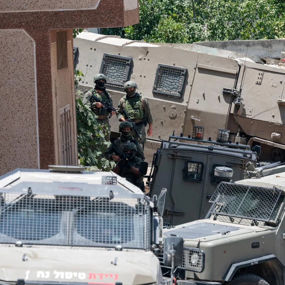 Members of the Israeli forces take part in a raid in Tal, near Nablus, the day after four Palestinians and two Israeli soldiers were killed in a shooting incident, in the Israeli-occupied West Bank, July 25, 2026. REUTERS/Mohammed Torokman