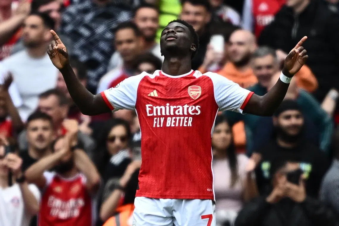 Soccer Football - Premier League - Arsenal v AFC Bournemouth - Emirates Stadium, London, Britain - May 4, 2024 Arsenal's Bukayo Saka celebrates scoring their first goal REUTERS/Dylan Martinez