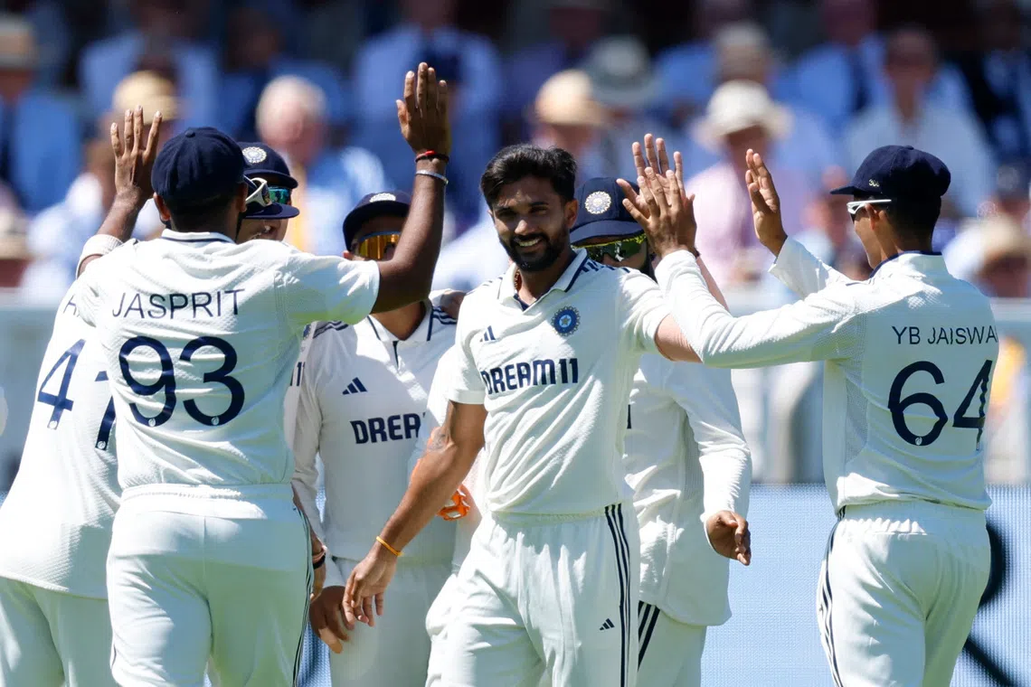 Cricket - International Test Match Series - Third Test - England v India - Lord's Cricket Ground, London, Britain - July 10, 2025 India's Nitish Kumar Reddy celebrates with teammates the wicket of England's Ben Duckett Action Images via Reuters/Peter Cziborra