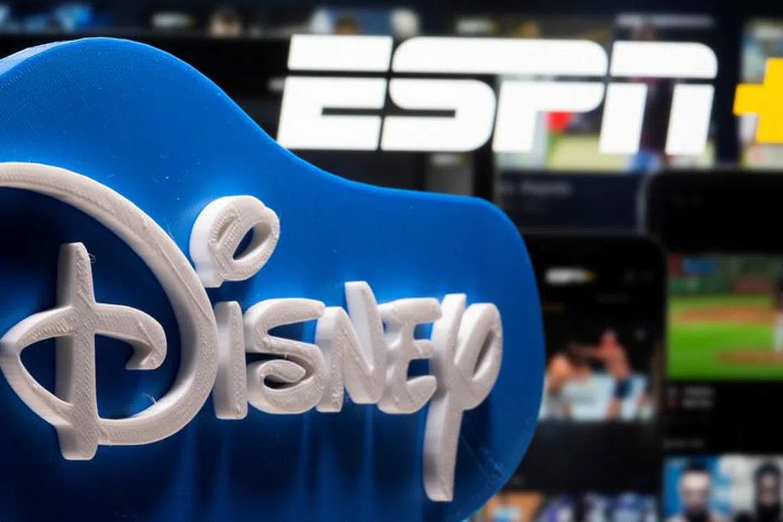 A 3D printed Disney logo is seen in front of the ESPN+ logo in this illustration taken on July 13, 2021. REUTERS/Dado Ruvic/Illustration