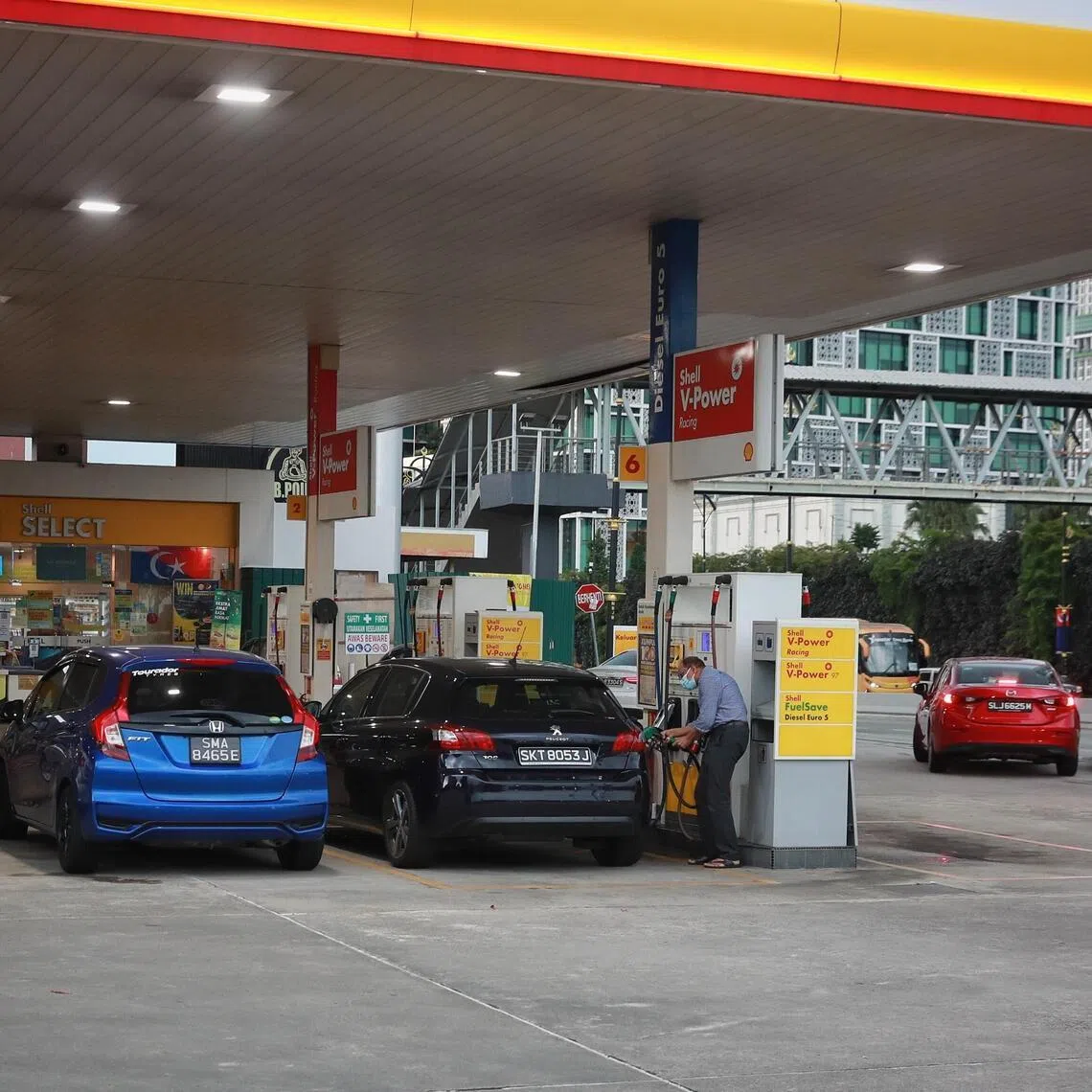 Singapore cars refuelling at a Shell petrol station in Johor Bahru.