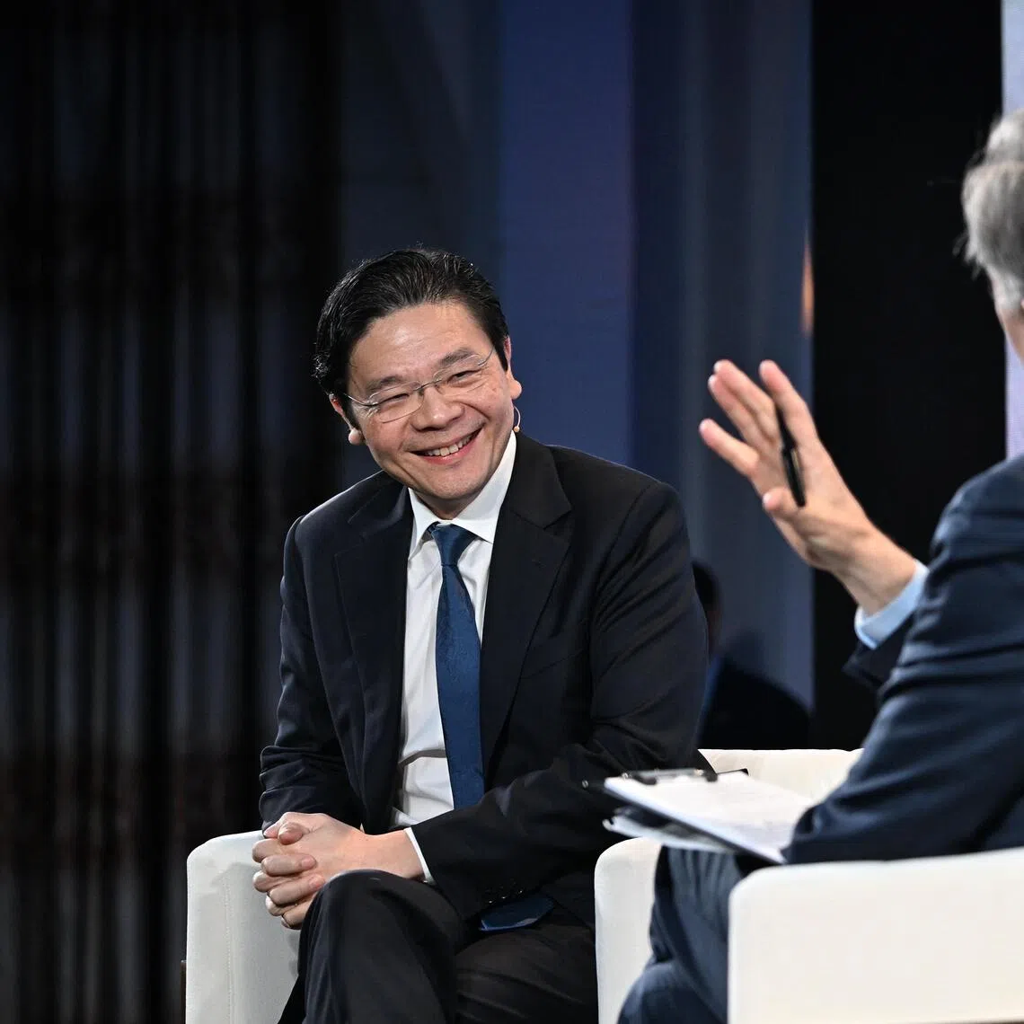 PM Lawrence Wong speaking at the Bloomberg New Economy Gala Dinner with moderator John Micklethwait on Nov 19.