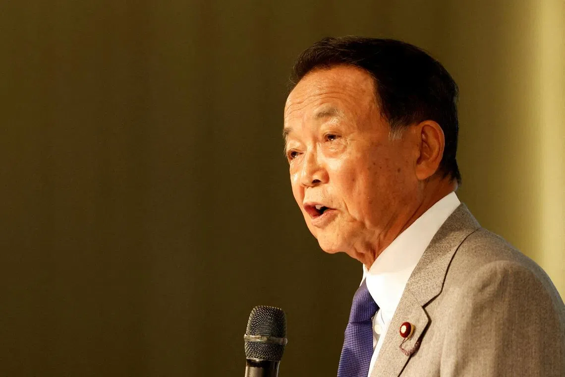FILE PHOTO: Japan's former prime minister and current vice vresident of the ruling Liberal Democratic Party, Taro Aso, speaks during the Ketagalan Forum in Taipei, Taiwan August 8, 2023. REUTERS/Carlos Garcia Rawlins/File Photo