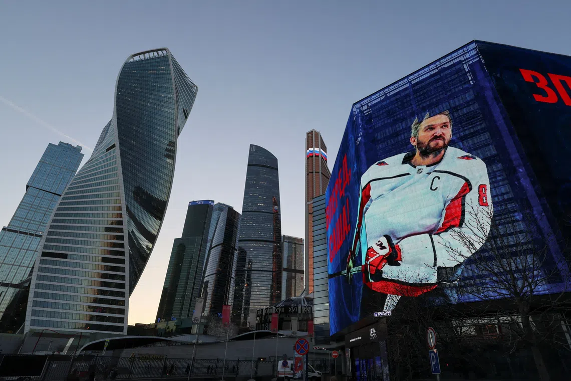 Alexander Ovechkin, the captain of the National Hockey League's Washington Capitals, is seen on a screen in support of his anticipated goals record, with backdrops of Moscow International Business District, also known as Moskva City, in Moscow, Russia April 3, 2025.  REUTERS/Shamil Zhumatov